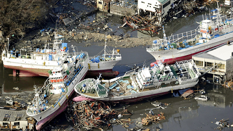Fishing boats lie piled atop debris in Kesennuma on Saturday. Hundreds were killed, and the number of dead is expected to rise